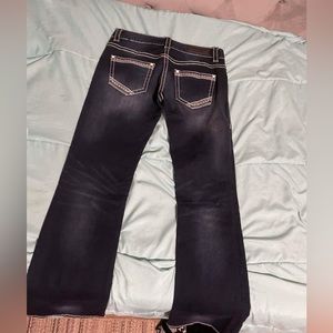 I’m selling rock and roll women boot cut jeans, size 26x32 low rise, dark blue